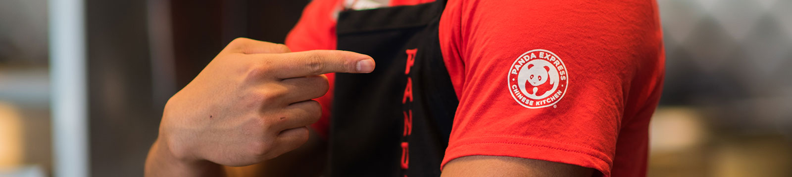 Panda employee pointing to logo