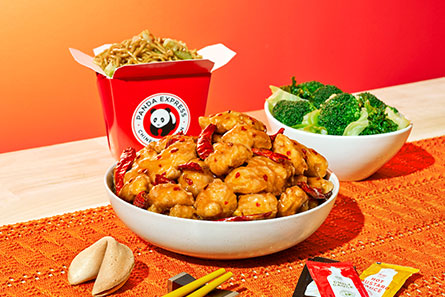table with Hot Orange Chicken and other food